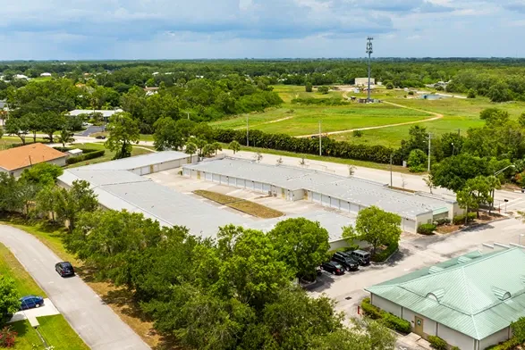 Aerial view of self storage facility with outdoor drive-up units in residential area